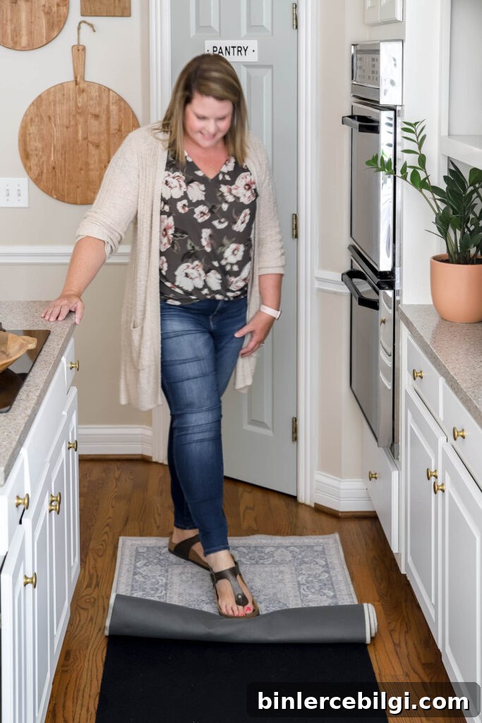 person rolling out a washable rug