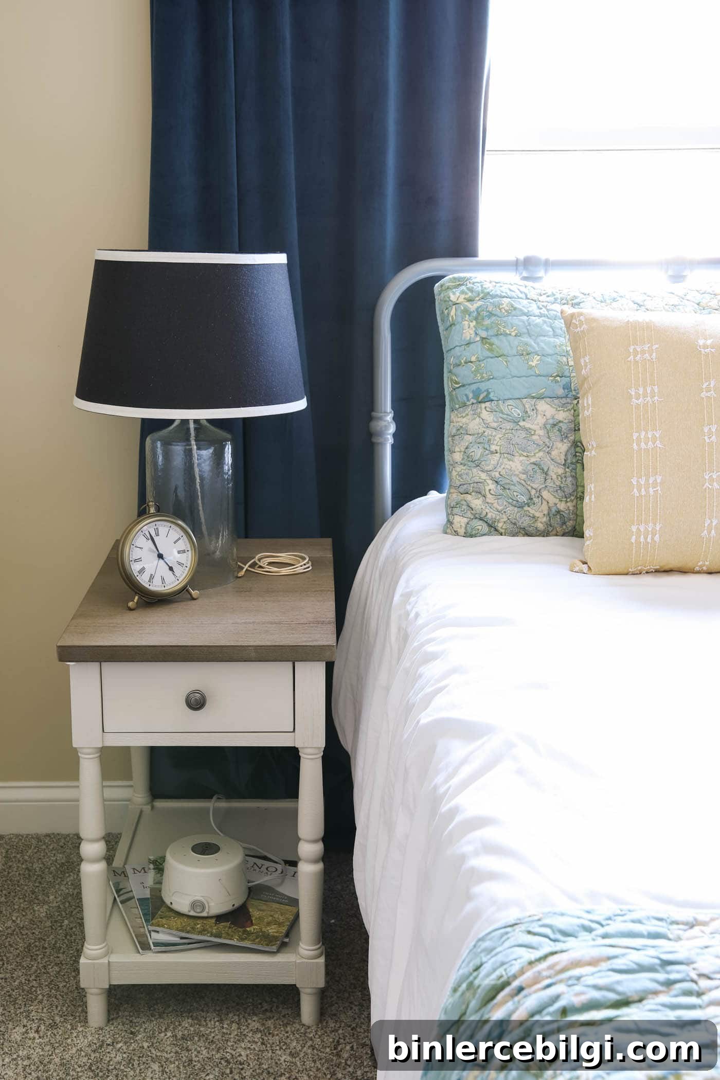 clock, noise machine and lamp in guest bedroom