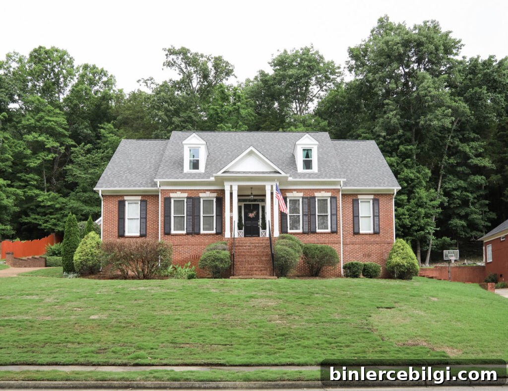 Brick Home Exterior Makeover (white trim and black shutters)