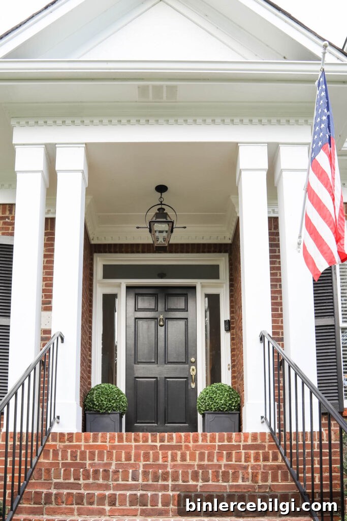 Brick Cape Cod Porch with Black Door