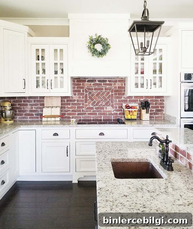 Alabaster cabinets with brick backsplash