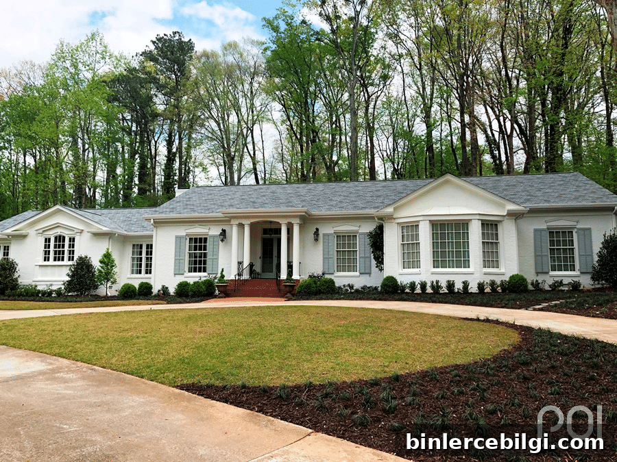 House painted Sherwin Williams Alabaster with a gray roof