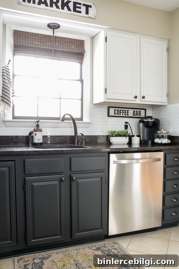 Kitchen with white upper cabinets and iron ore painted lower cabinets