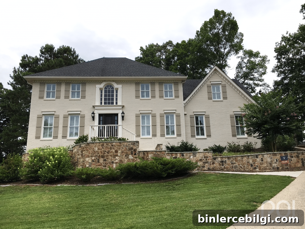 large two story home with sw accessible beige painted brick