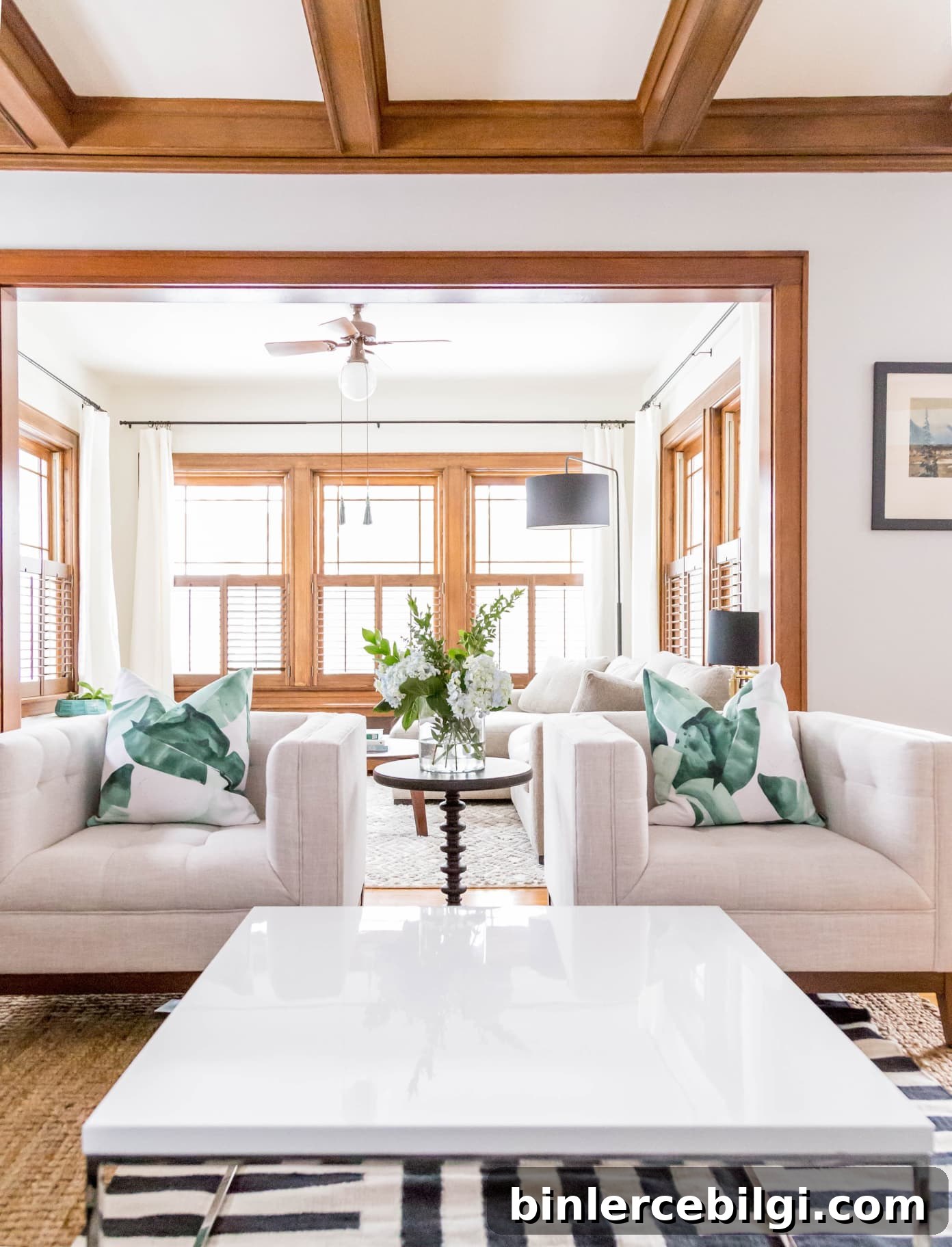 living room with wood trim and neutral white paint