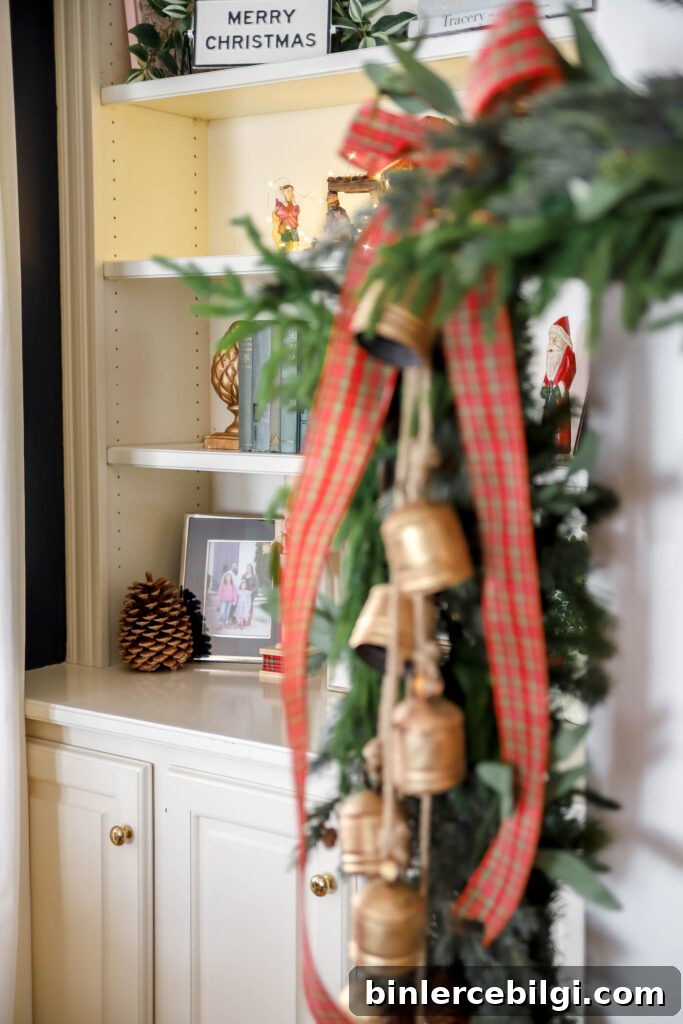 Peek-a-boo Santa on bookshelves