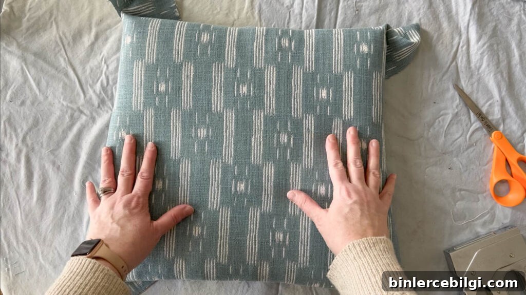 Inspect the top of the reupholstered seat