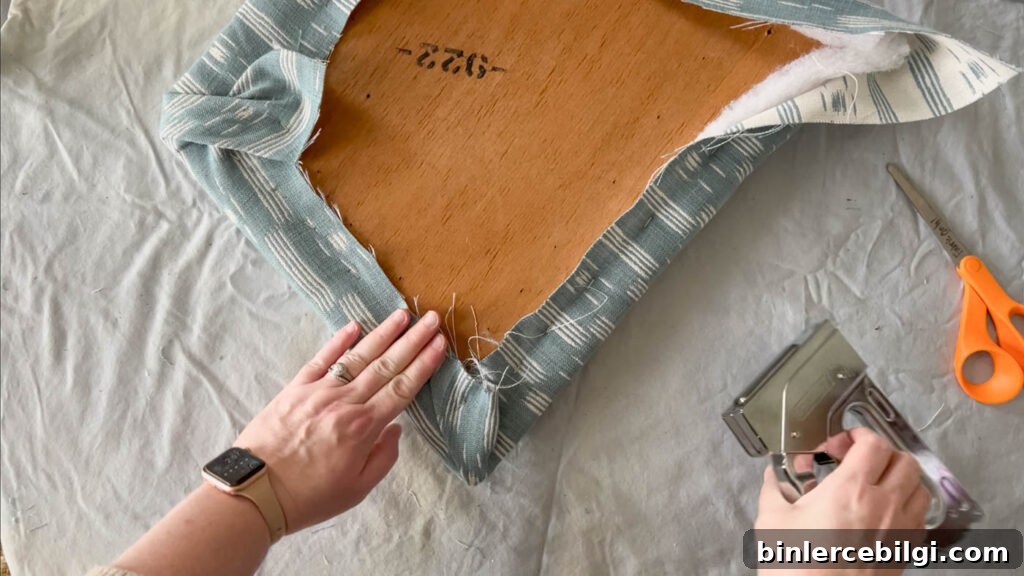How to staple corners when reupholstering a chair