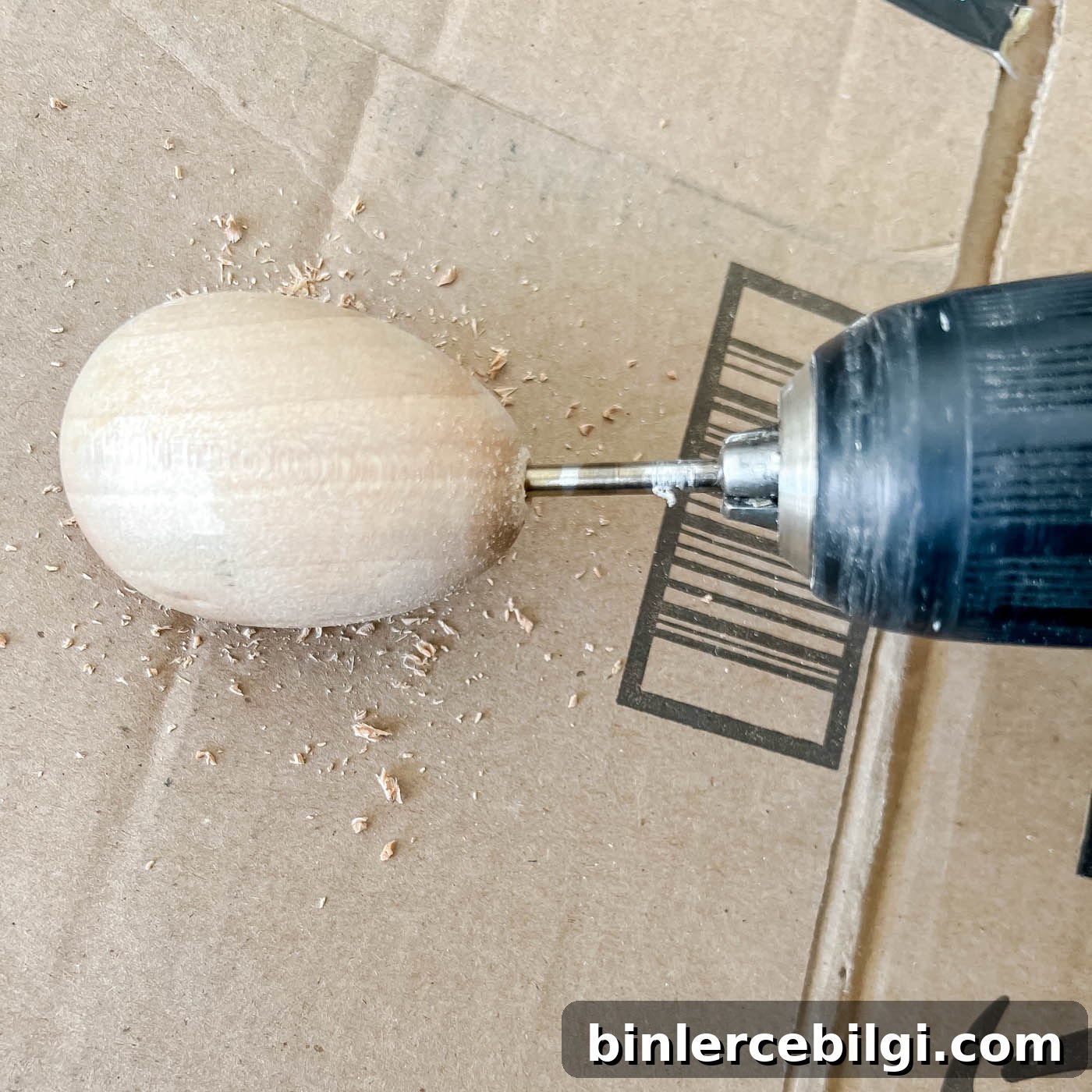 Drilling a hole in a wooden egg