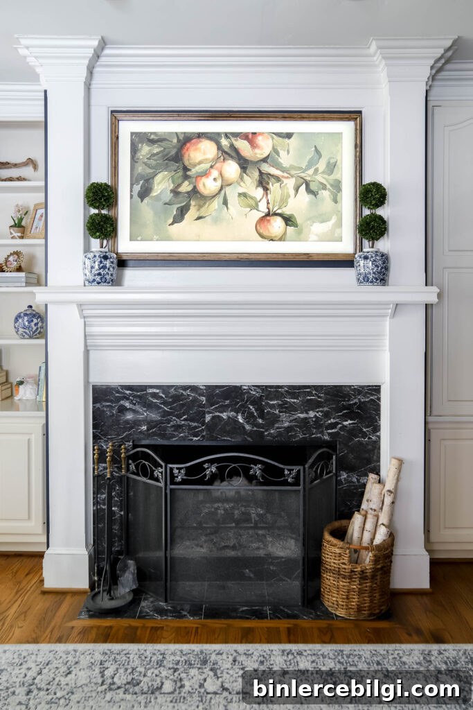 Frame TV above fireplace mantel