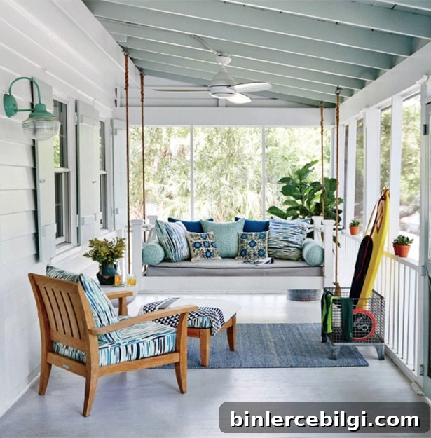 throw pillows decorating the furniture in a screened-in porch