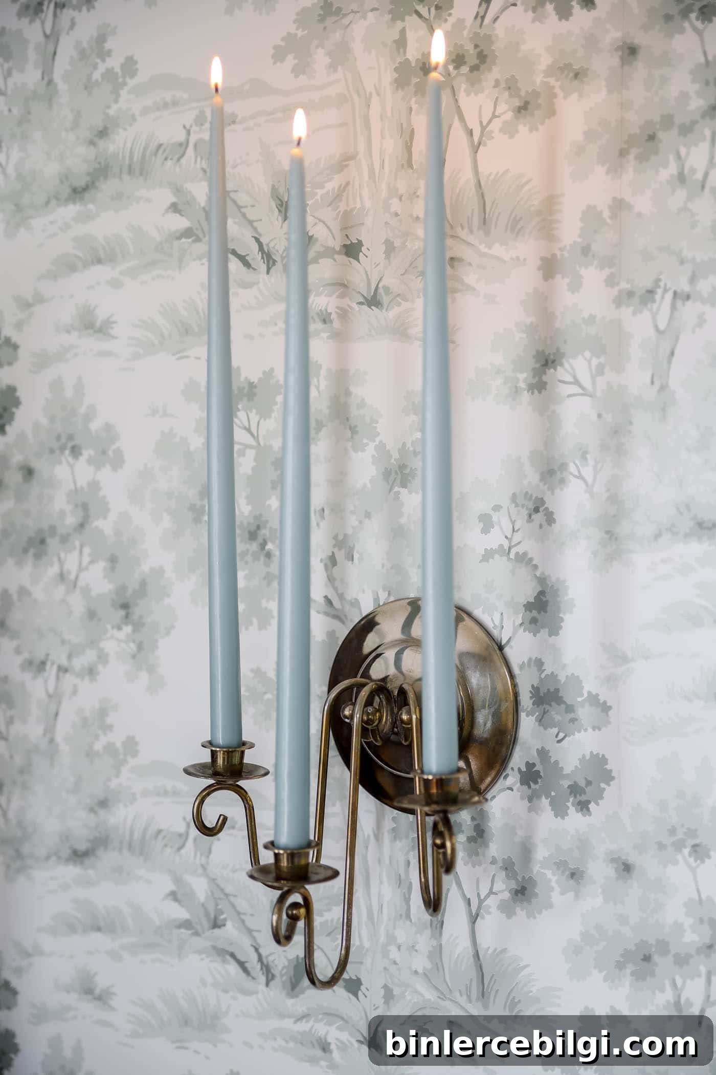 Blue candles in vintage candle sconce