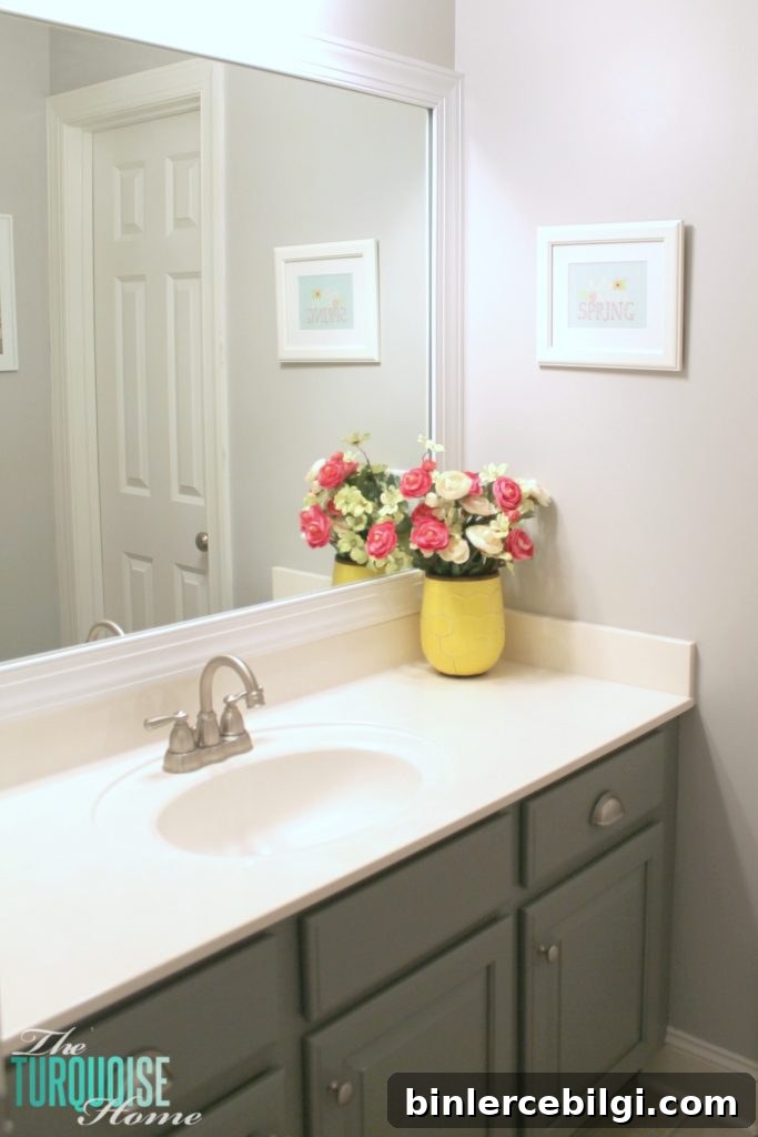 Finished framed mirror in bathroom