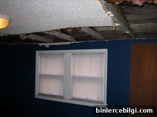 Guest bedroom before renovation with water damage