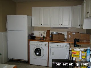 Kitchen before, with laundry in kitchen