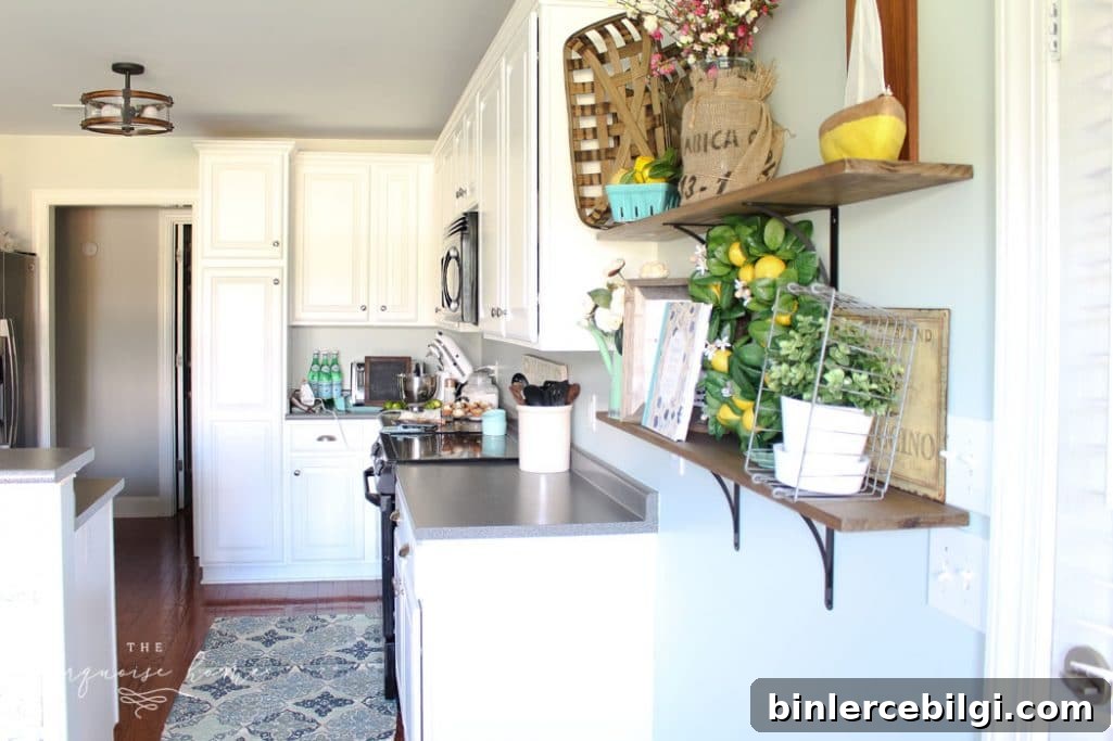 Sea Salt by Sherwin Williams on kitchen walls with Simply White cabinets