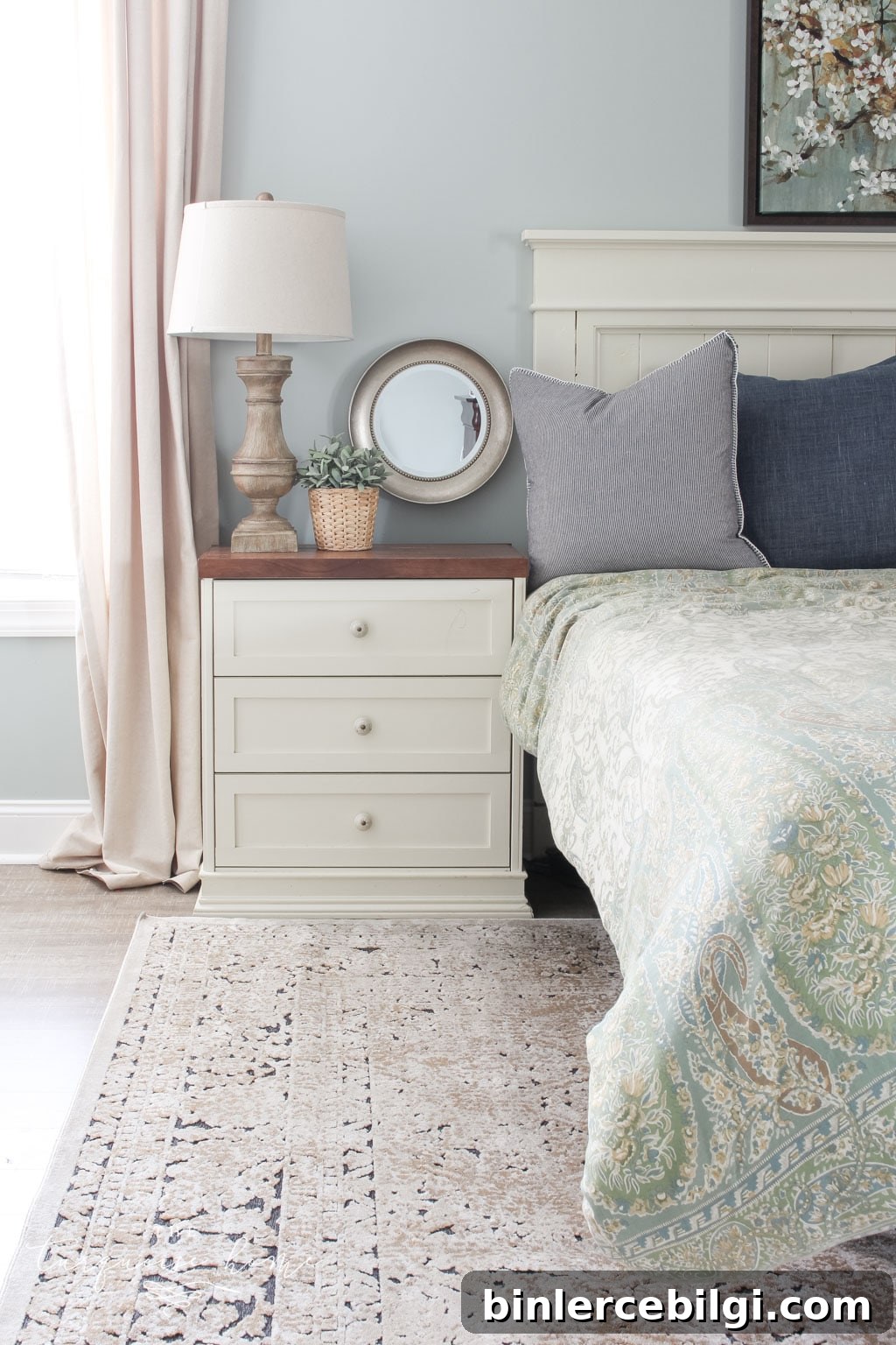 Gorgeous Ivory and Beige Antique-style Rug in a Farmhouse Master Bedroom. What size rug to buy for a king bed?