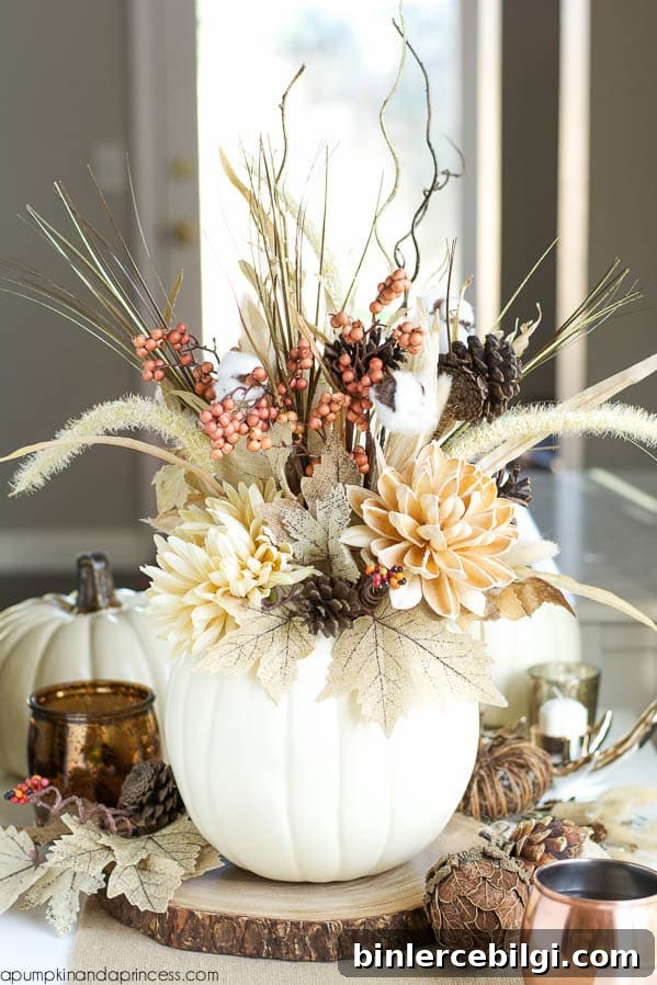 white pumpkin acting as a vase with a floral display inside