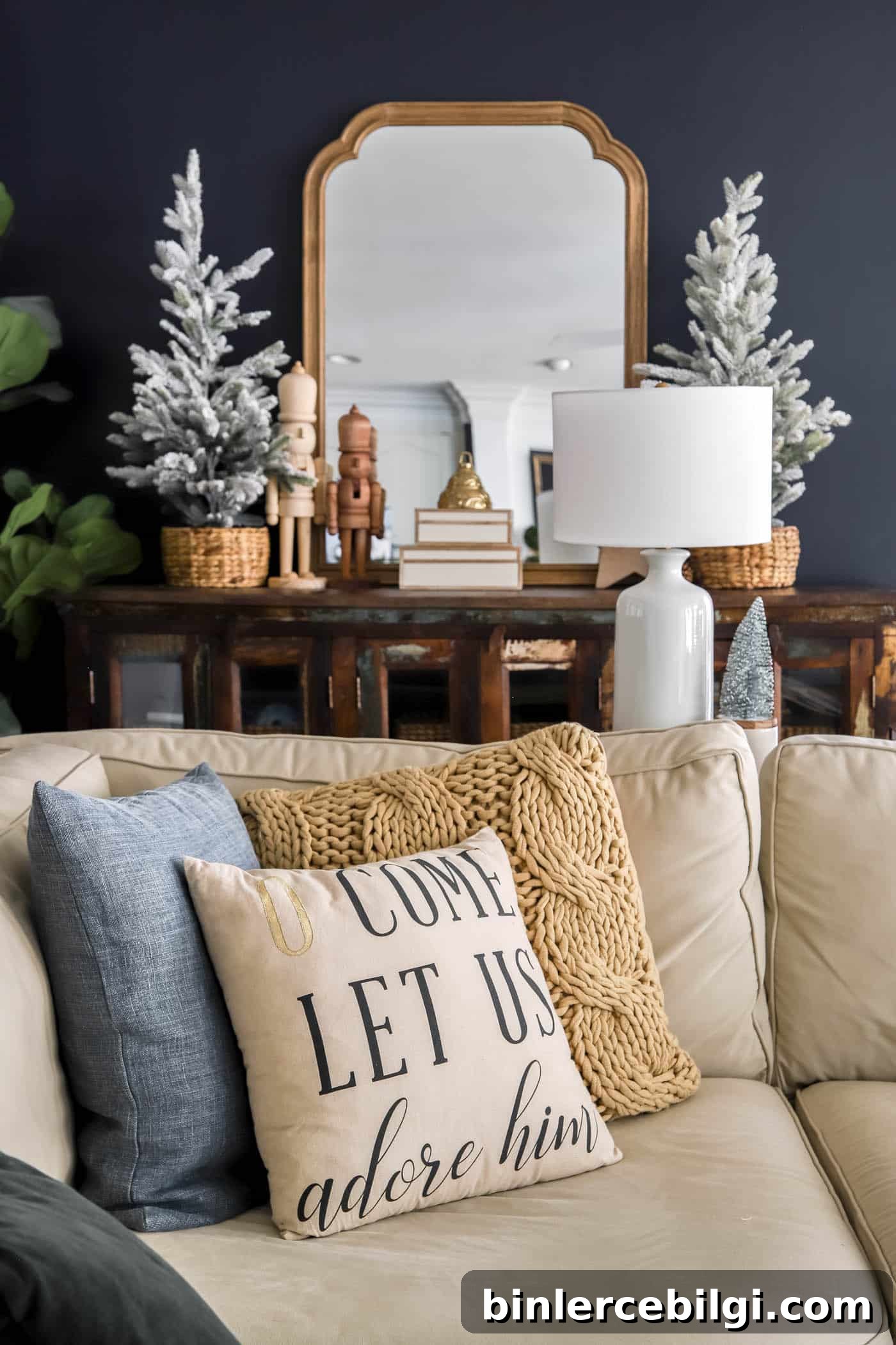 Christmas decorated media cabinet in navy living room