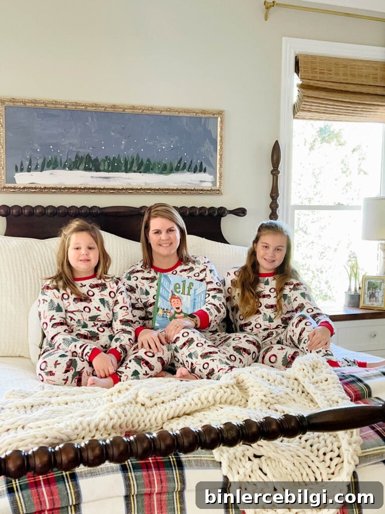 mom and daughters in christmas pjs on the bed