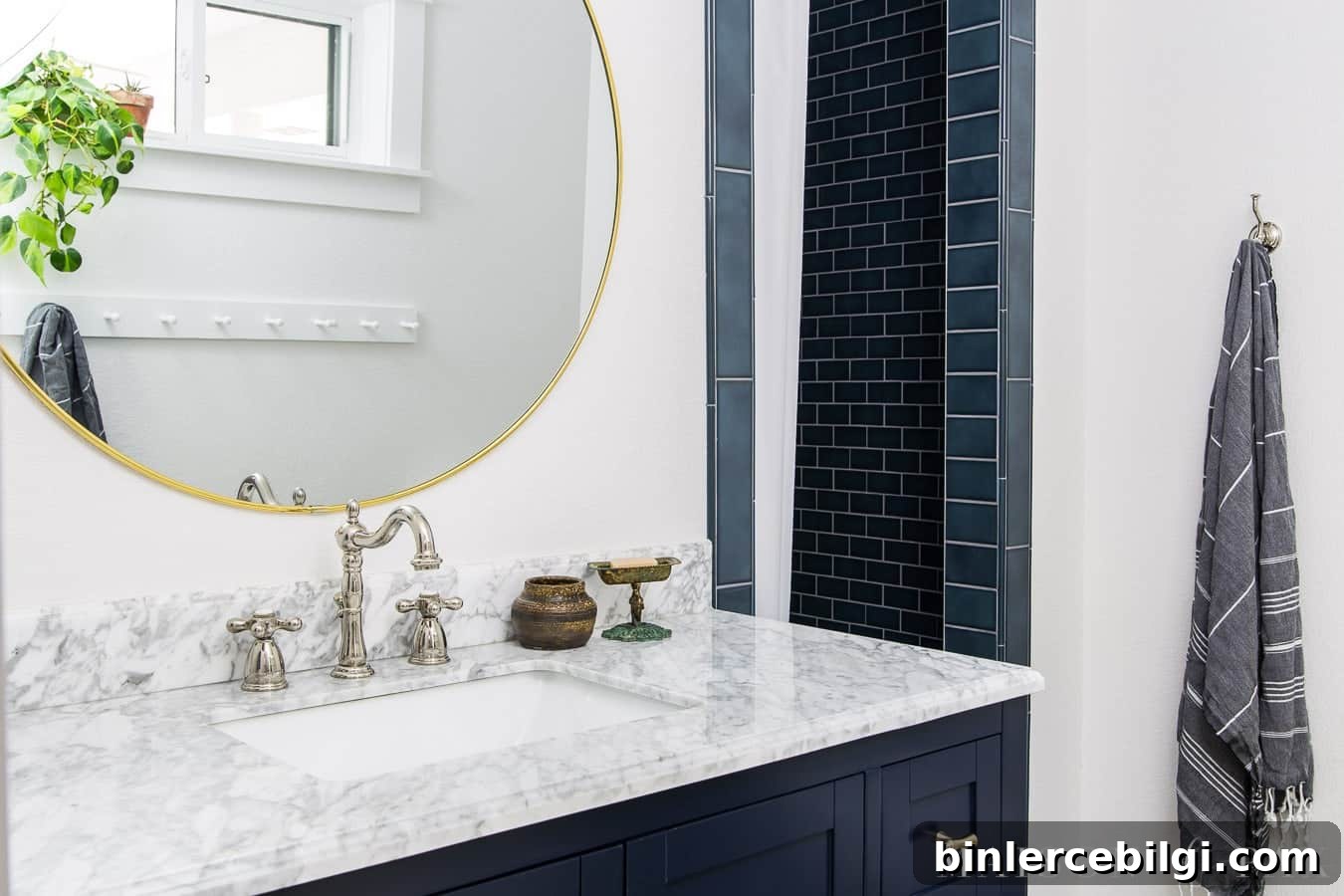bathroom with white walls and navy accents