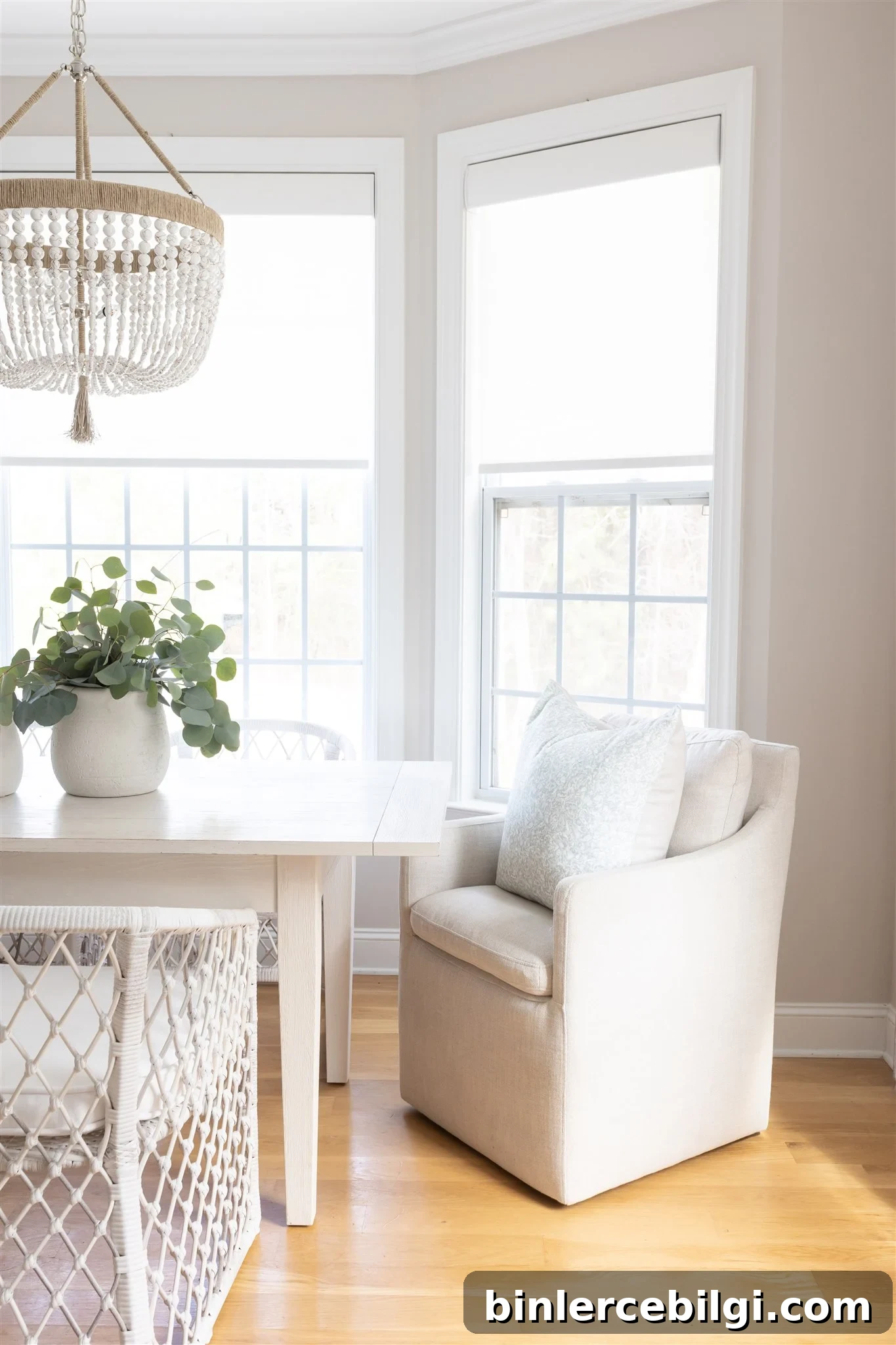 How to Use Benjamin Moore Balboa Mist Paint in Your Home 7 dining room with balboa mist walls, white trim, farmhouse decor and a chandelier