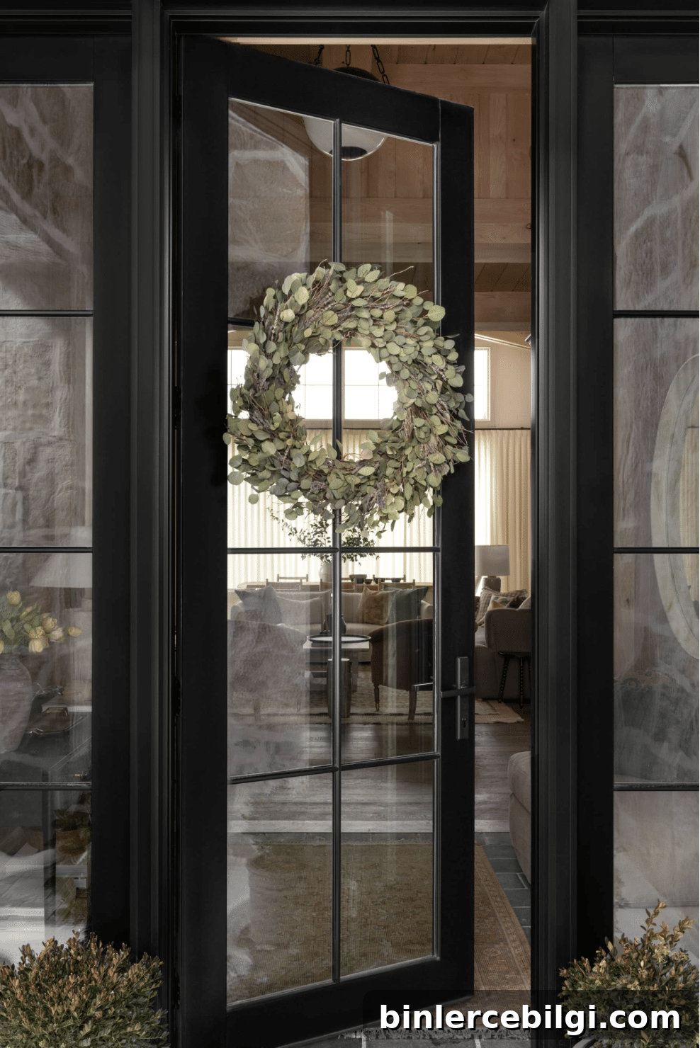 front black door with entryway rug.