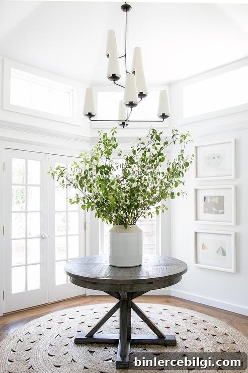 round gray wood trestle table with round crochet rug