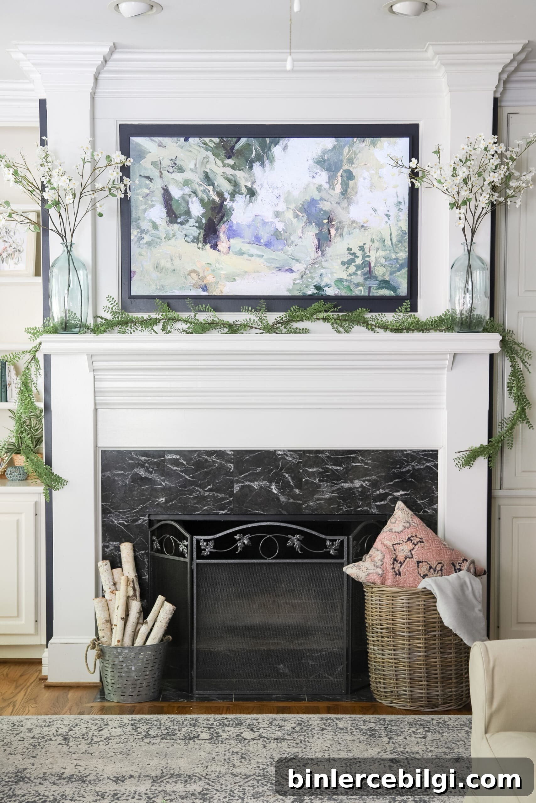 mounted Frame TV above fireplace mantle in living room