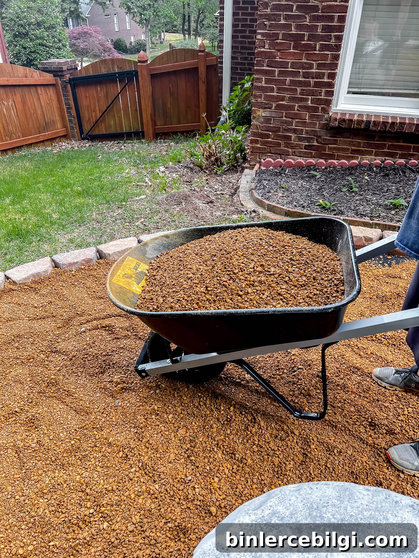 How to Build a DIY Pea Gravel Fire Pit Area 9 Add pea gravel to fire pit area.