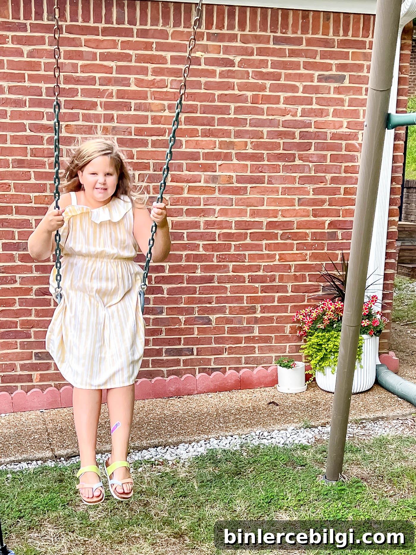 girl swinging in pretty dress