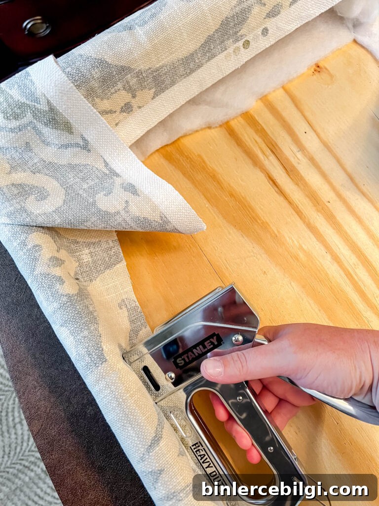 DIY cornice board stapling fabric