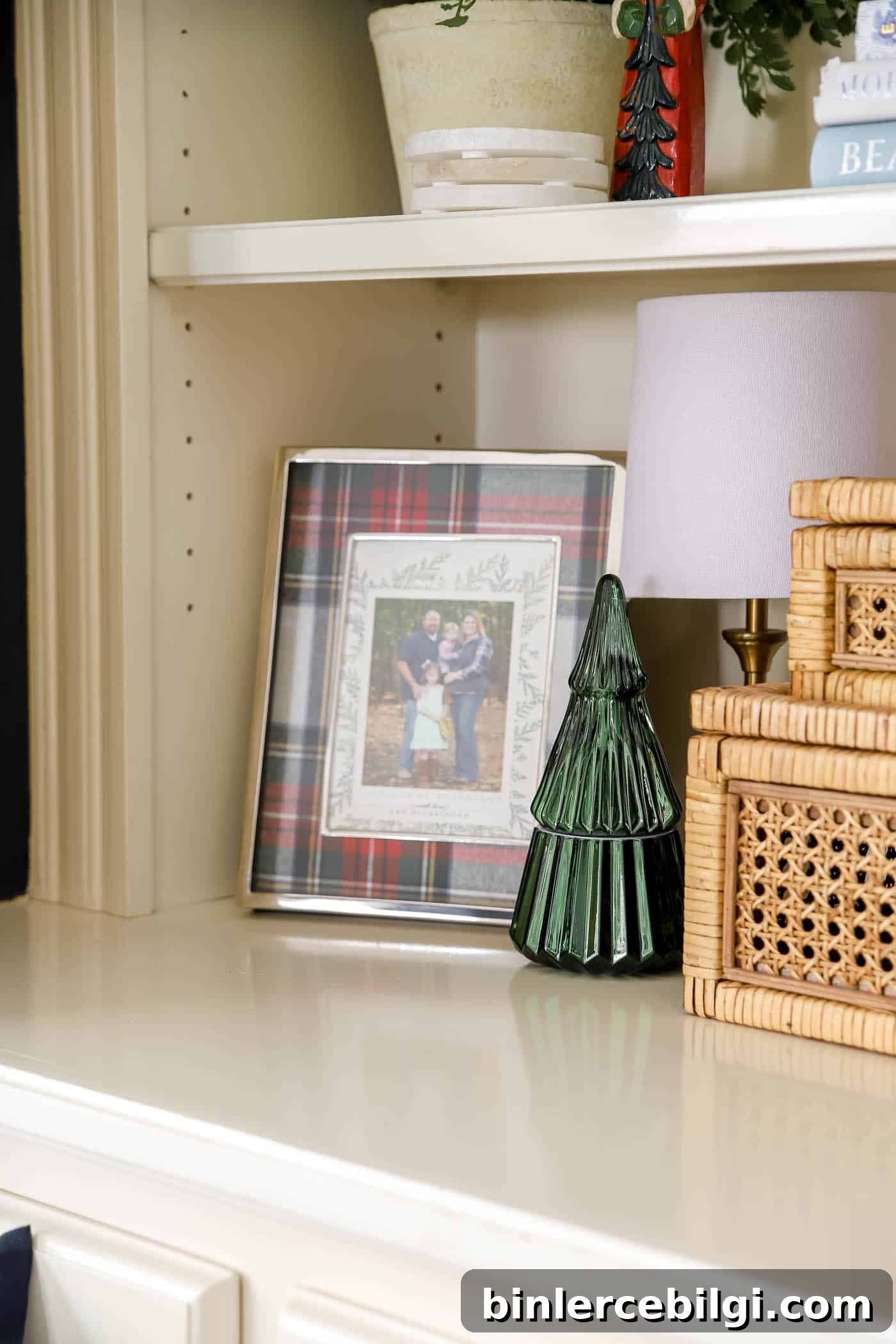 green candle decor and plaid picture frame