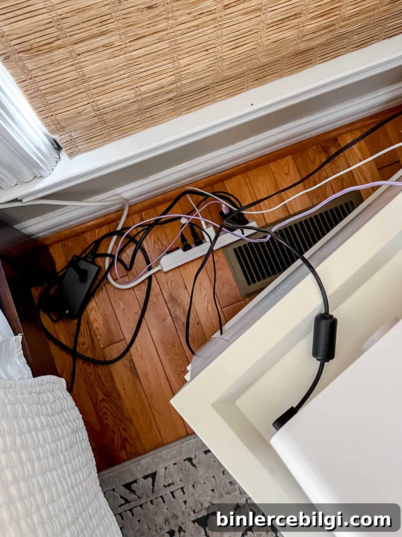 messy cords behind nightstand 