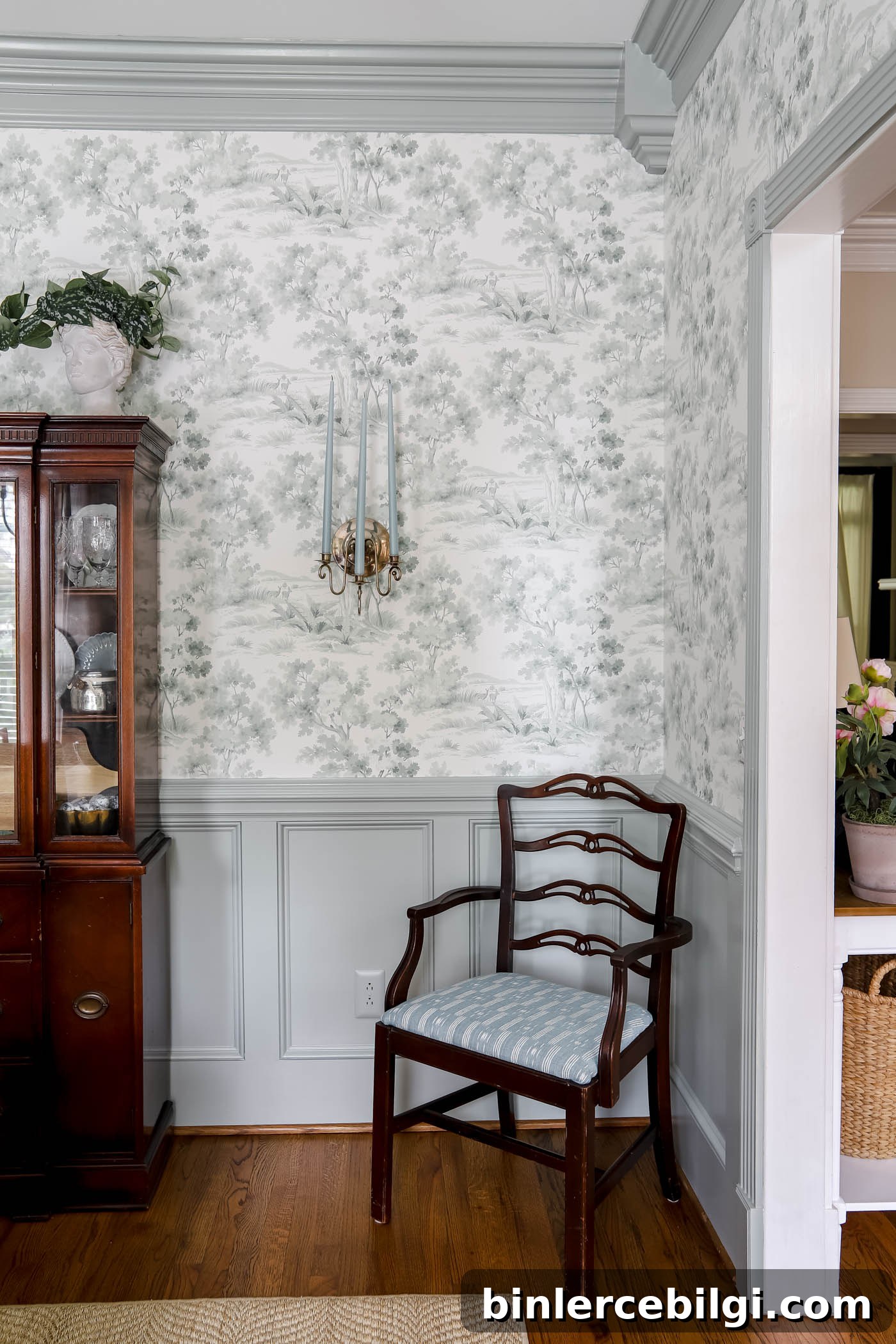 Layered Wainscoting in Dining Room with Sherwin Williams Oyster Bay painted wainscoting and toile wallpaper on the wall.
