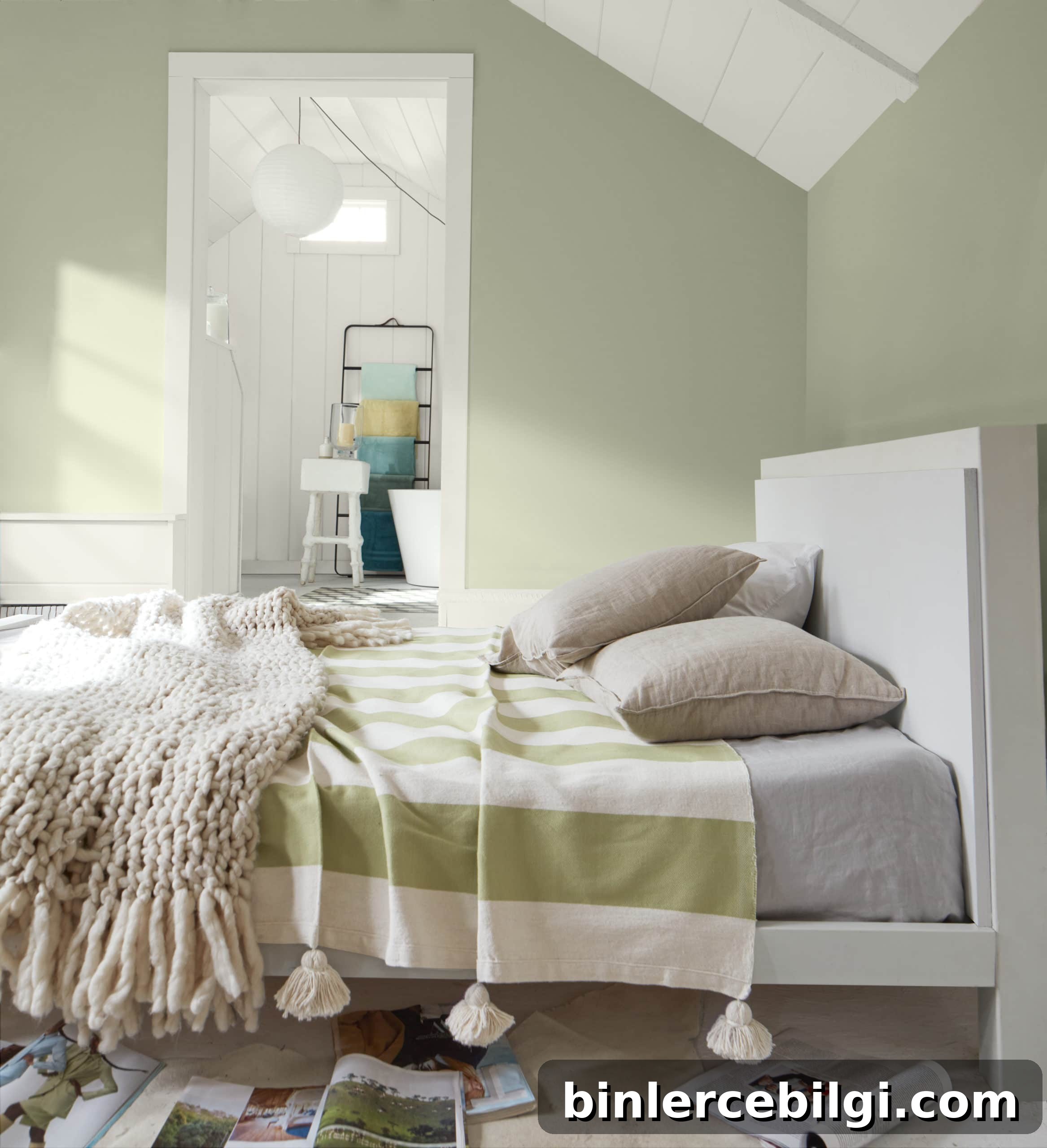 Benjamin Moore October Mist walls with white bed and green and white striped bedding.
