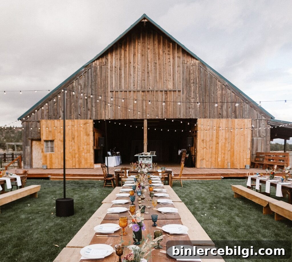 barn with party tables and string lights.