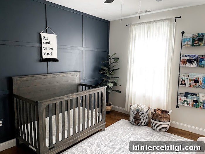 Boy's nursery with Hale Navy accent wall and wood crib.