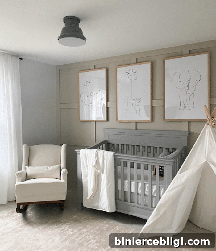 Animal art hanging over a gray crib in a nursery with Revere Pewter walls and a white glider.