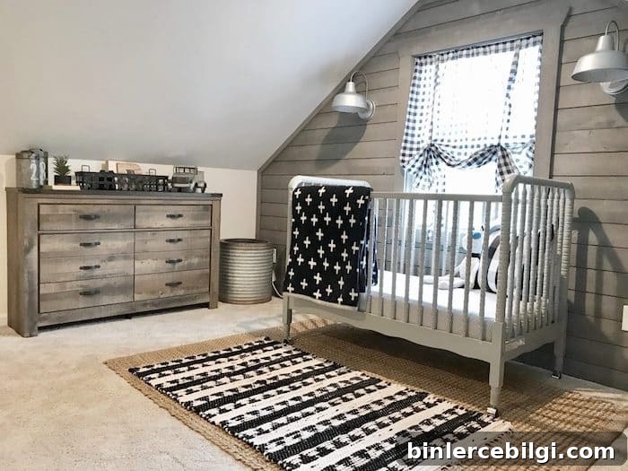 Attic nursery with a slatted wood feature wall.