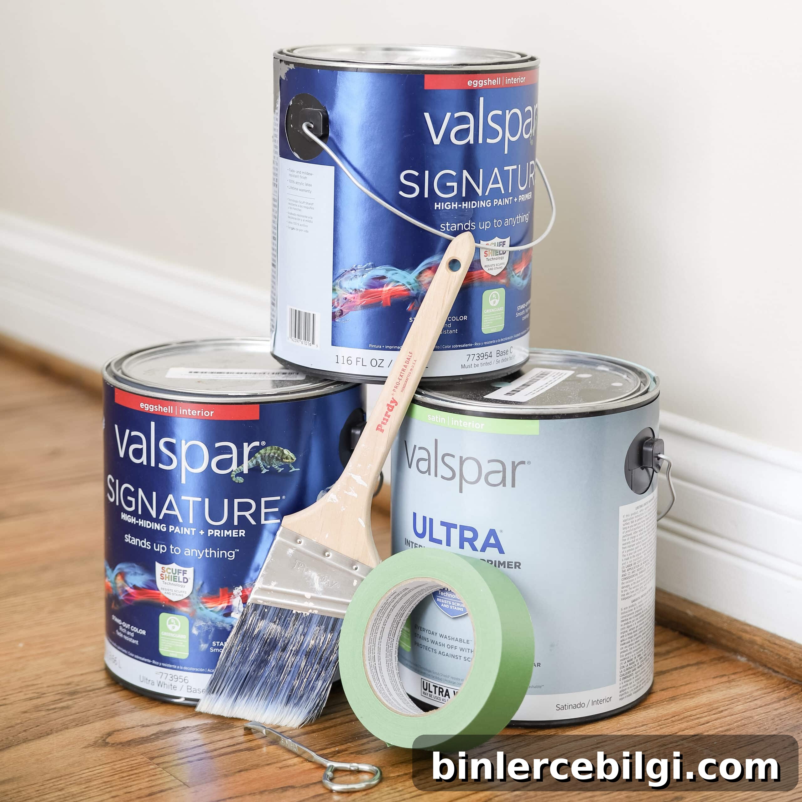 paint cans, paint brush, and painter's tape