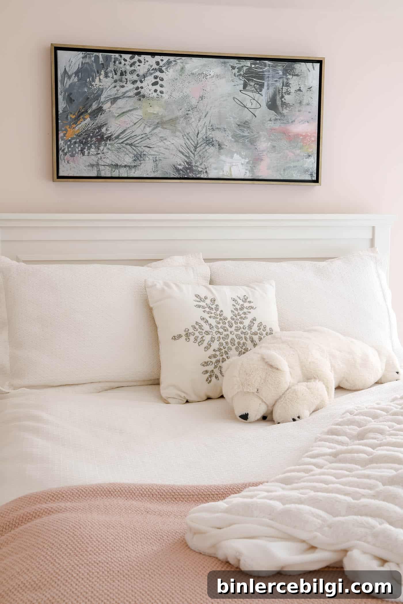 abstract plant art above bed.