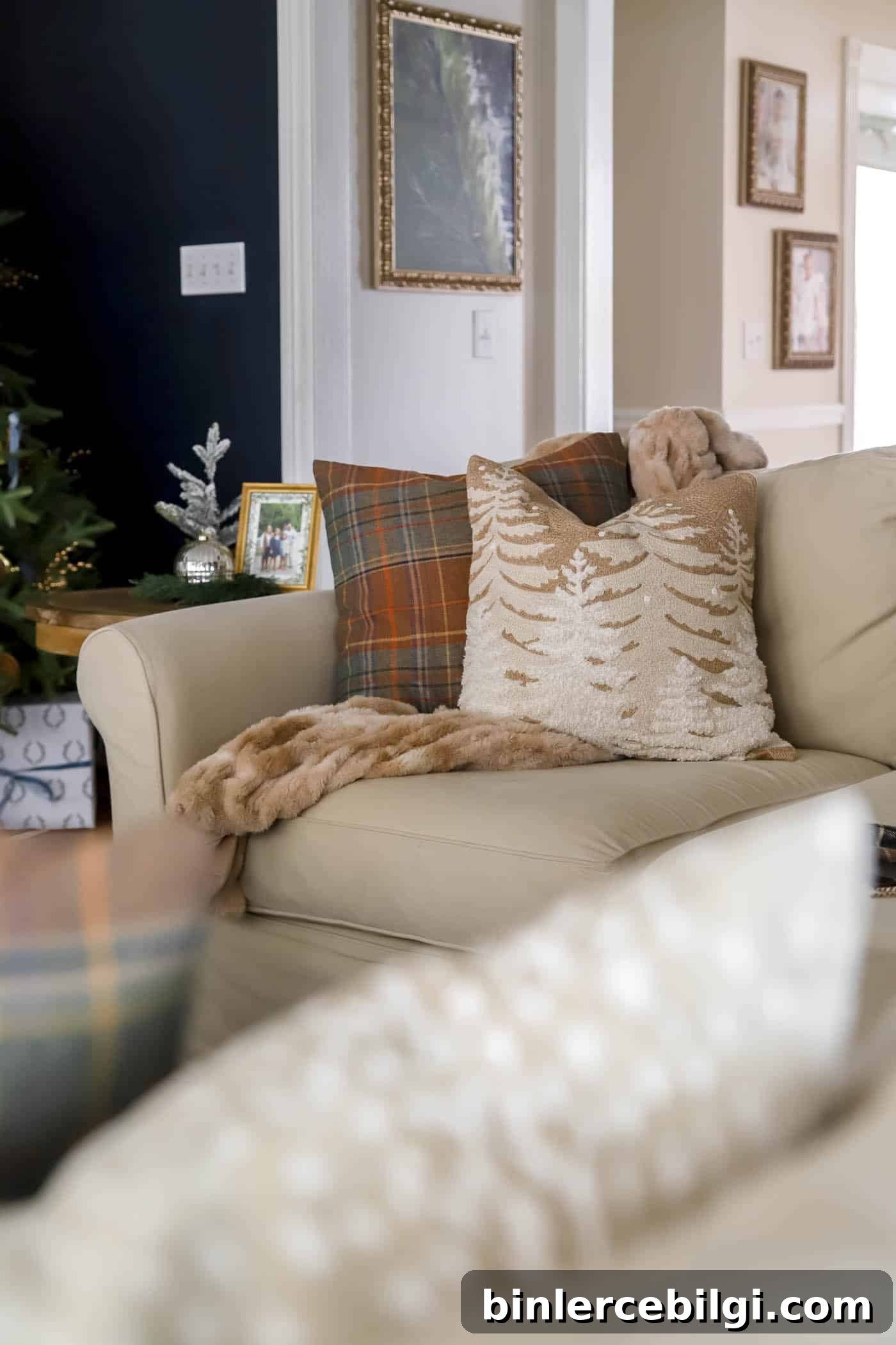 brown and orange plaid pillow and wintery scene pillow cover.