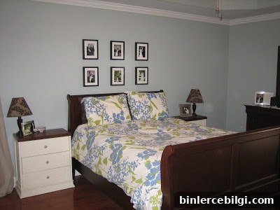 bedroom with too small art above the bed is one of the things that make your home look cheap.