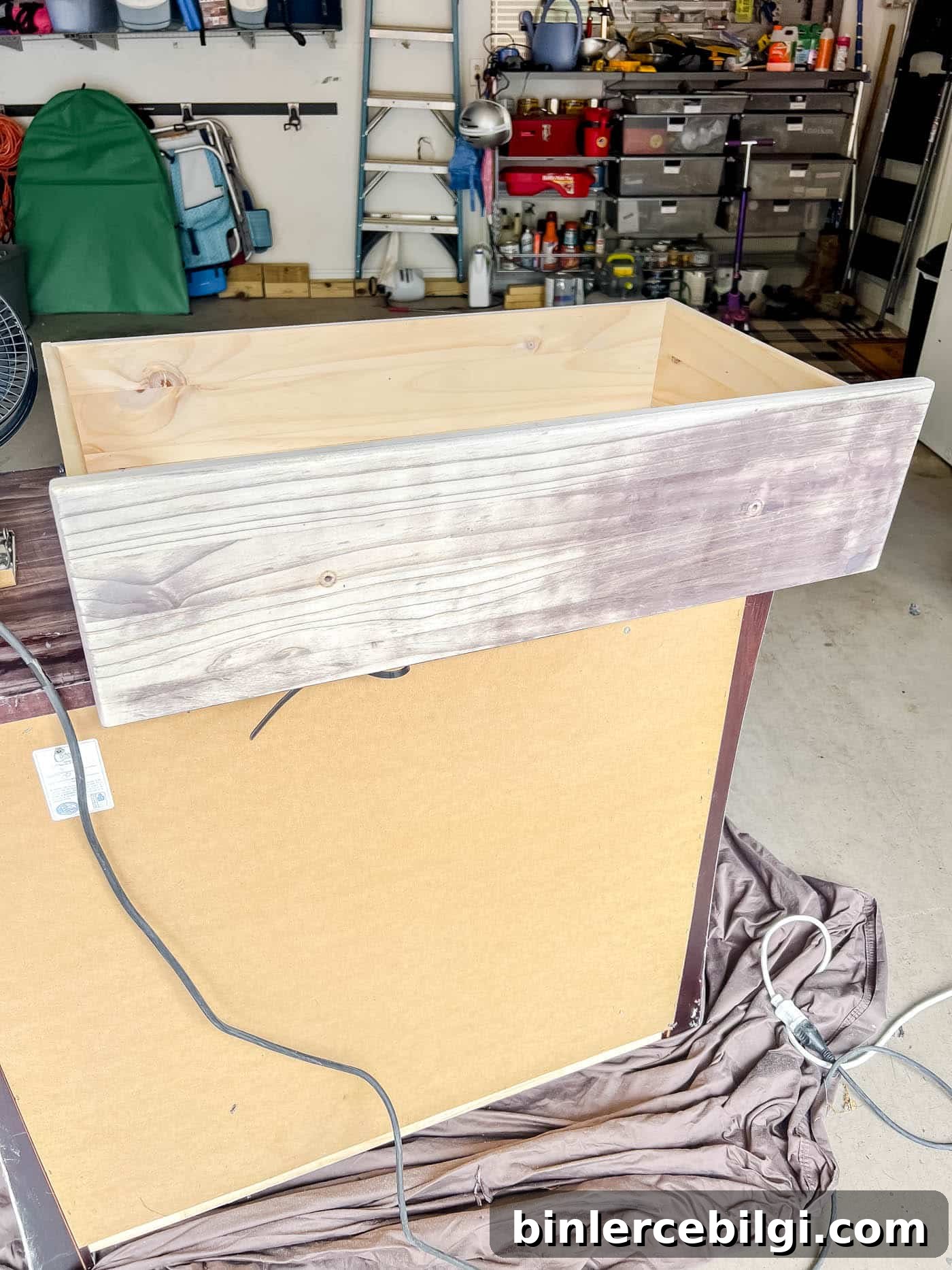 Refinish Wood Furniture: Step-by-Step DIY Guide 10 sanding down the drawers with a sheet sander.