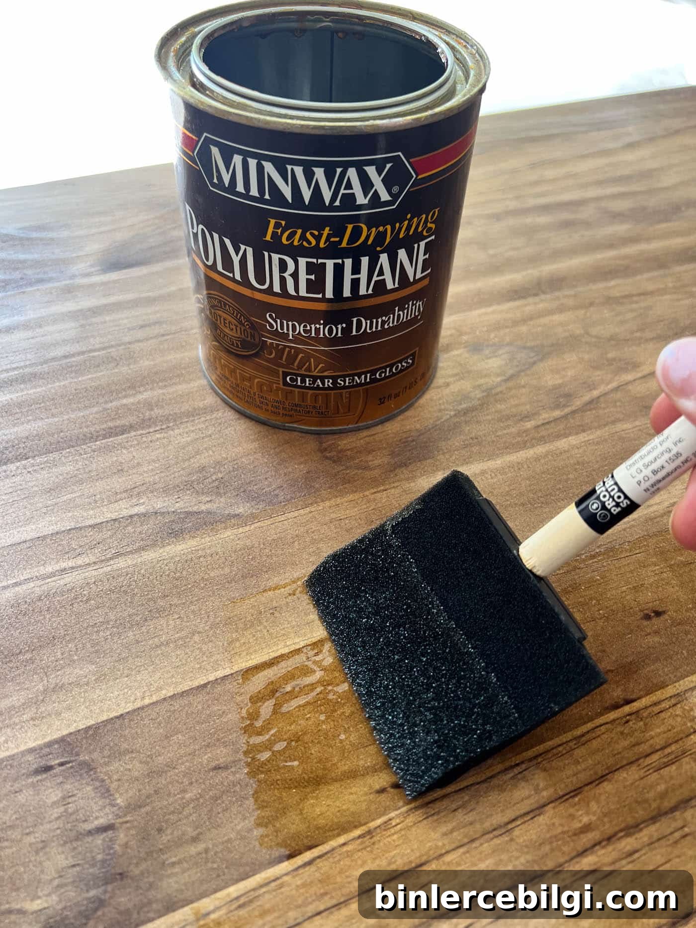 Refinish Wood Furniture: Step-by-Step DIY Guide 16 applying a top coat to a newly stained piece of furniture.