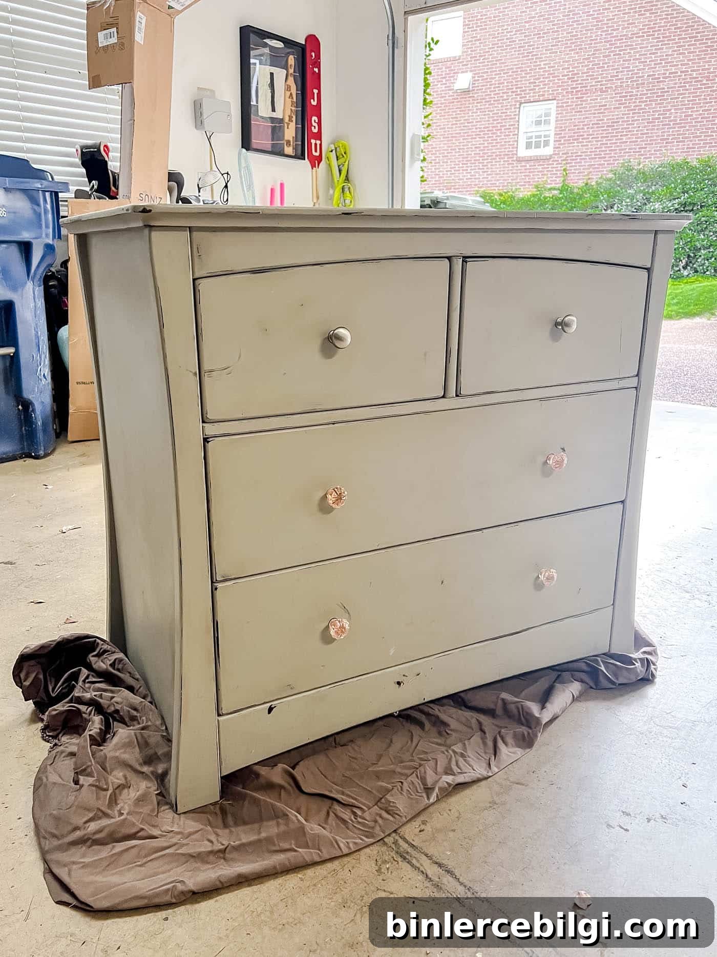 Refinish Wood Furniture: Step-by-Step DIY Guide 6 gray chalk painted dresser in garage on an old bed sheet.