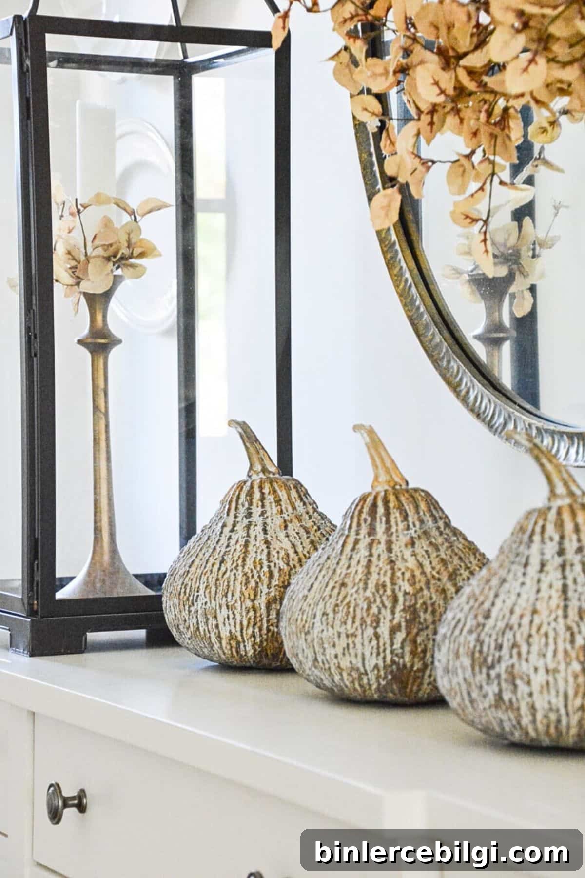 concrete gourds and lantern for fall decor.