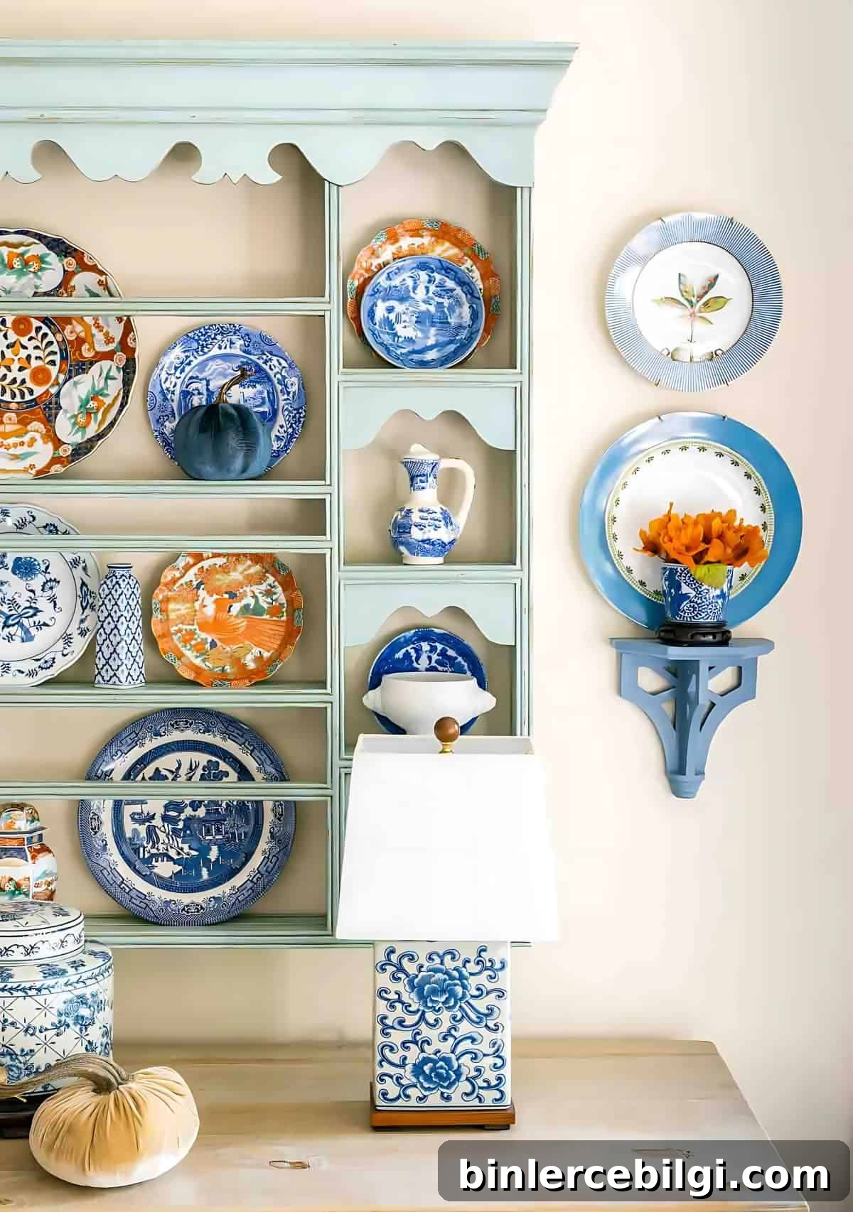 blue and white plates in a plate rack and on the wall.