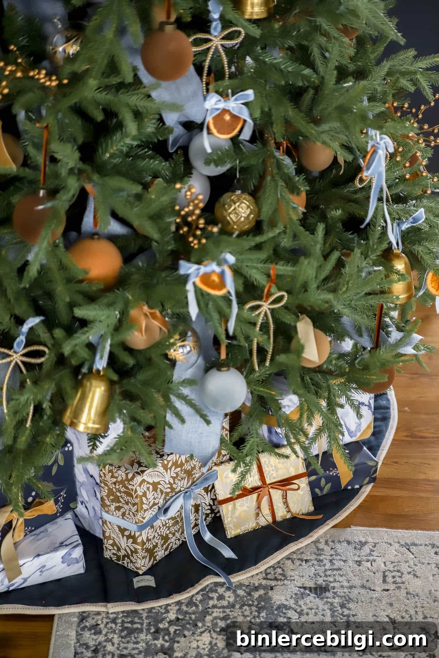 2025 Christmas Decor Trends to Watch 10 close up of blue, brown and orange Christmas tree